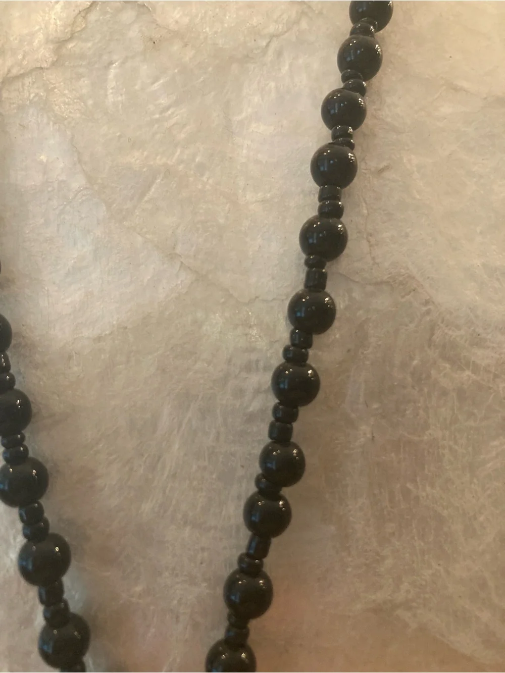 Black stone carved Buddha Head Pendant Necklace - beaded knotted chain.